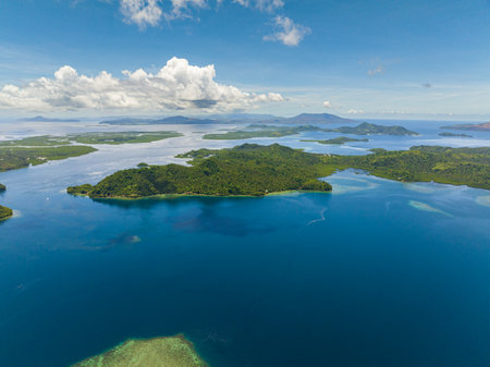 Tropical islands surrounded by blue water and sky landscape, travel concept. Mindanao, Philippines.の写真素材