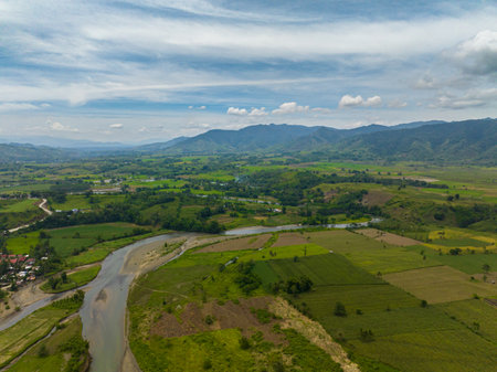 Tropical mountain with rice fields and winding river. Mindanao, Philippines.の写真素材