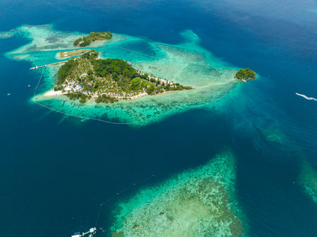 Blue sea and tropical island with beach. Samal, Philippines.の写真素材