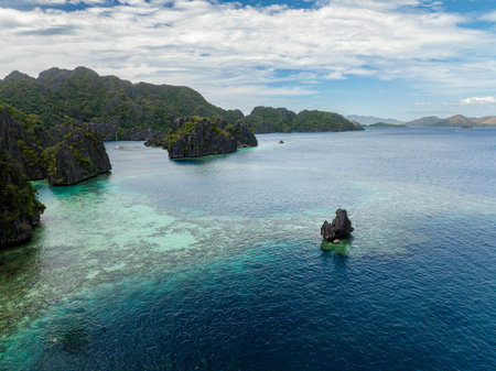 Splendid limestone rock formation in Coron. Islet and blue sea. Palawan, Philippines.