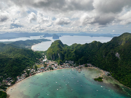 Coastal town in El Nido. Turquoise sea water with tourist boats. Palawan. Philippines.の写真素材