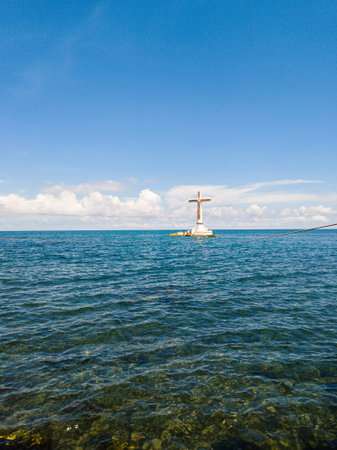 Big cross in the middle of the sea. Sunken Cemetery in Camiguin Island. Philippines.の写真素材