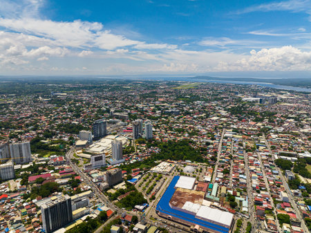 Aerial view of Downtown of Davao City. Traffic highway transportation. Modern buildings and Malls. Mindanao, Philippines.の写真素材