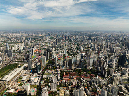 Panoramic view of Bangkok showcasing skyscrapers, modern architecture, and clear skies above the...