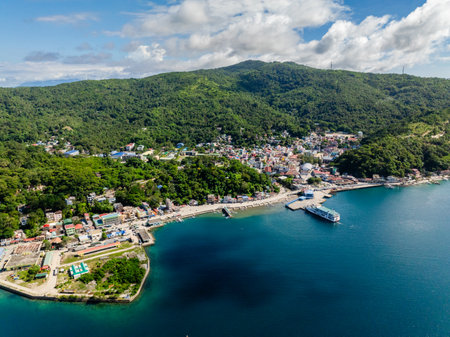 Coastal city with buildings and residential area. Romblon, Philippines.の写真素材