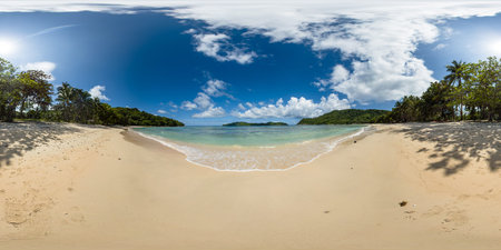 Tropical beach with transparent sea water and waves. Blue sky and clouds. El Nido. Palawan....