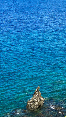 Blue sea and waves on rocks. Camiguin Island. Philippines.の写真素材