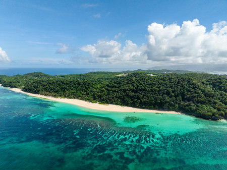 Clear turquoise water with coral reefs. White sand in Puka Shell Beach. Boracay, Philippines.の写真素材