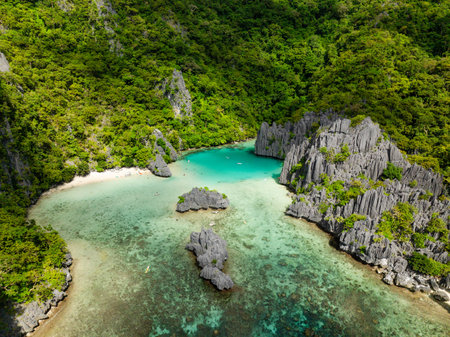 Cadlao Lagoon with transparent turquoise sea water with corals in El Nido, Philippines.