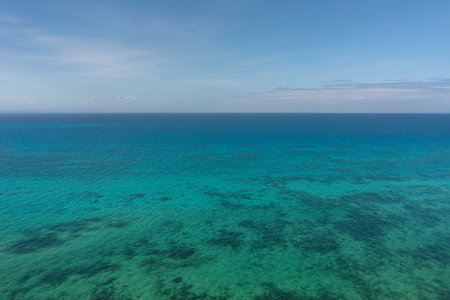 Sea surface with corals in Bantayan, Cebu. Philippines. Seascape with turquoise sea water.の写真素材