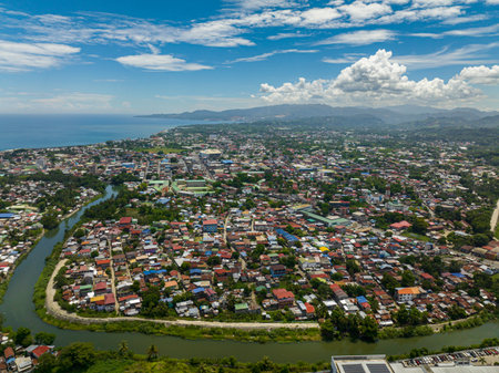 Village in riverside of Iligan City. Blue sky and clouds. Northern Mindanao, Philippines.の写真素材