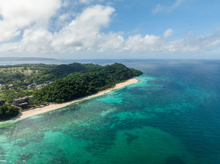 Coastline with white sandy and clear turquoise sea water and waves. Puka Beach. Boracay, Philippines.の写真素材