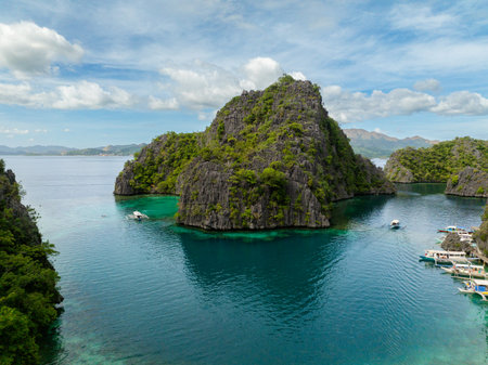Turquoise water lagoon with group of boats in Kayangan Lake. Coron, Palawan. Philippines.