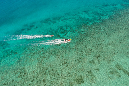 Motorboats over the the ocean. Clear turquoise sea water with coral reefs. Bantayan, Cebu, Philippines.の写真素材