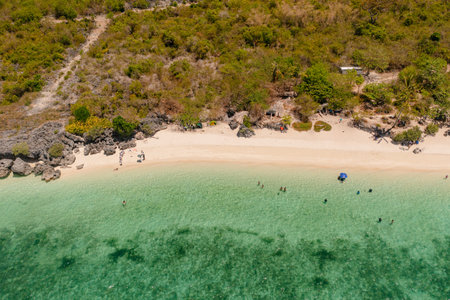 White sandy beach and crystal clear sea water in Sandira Beach. Bantayan Island, Cebu, Philippines,の写真素材