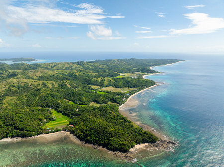 Tropical Island surrounded by turquoise sea water and reefs. Santa Fe, Tablas, Romblon. Philippines.の写真素材