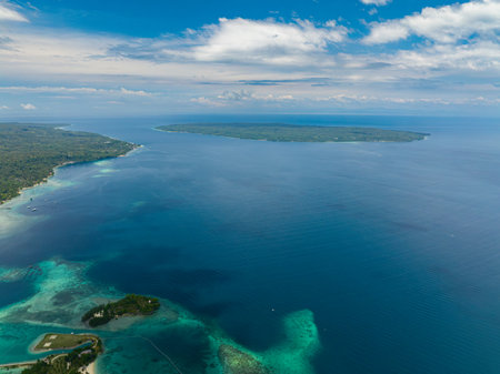 Blue sea and tropical island. Blue sky and clouds. Samal, Philippines.の写真素材