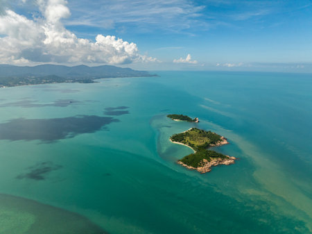 Scenic view of isolated tropical islands surrounded by turquoise waters and lush greenery. Bo Put. Koh Samui, Thailand.の写真素材