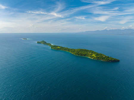 Tropical island with deep blue sea. Blue sky and clouds. Ligid Island in Samal, Davao. Philippines.の写真素材