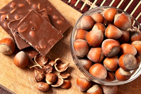 bowl of hazelnuts and chocolateの写真素材