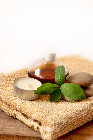 spa candle, oil, stones and towelの写真素材