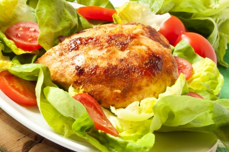 Baked chicken breast with saladの写真素材