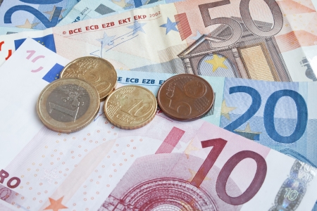 international money,financial concept,euro banknotes and coins の写真素材
