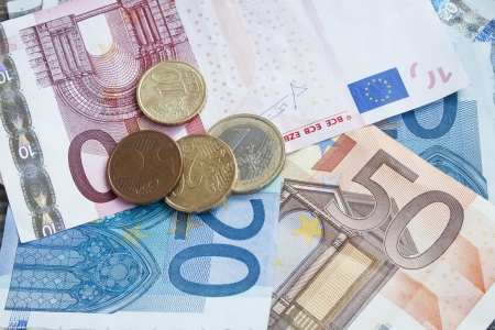international money,financial concept,euro banknotes and coins の写真素材