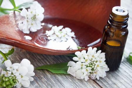Bottle of flower essence and flowers for spa treatmentsの写真素材