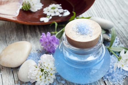 spa oil bottle with spa flowers,sea salt and massage stones の写真素材