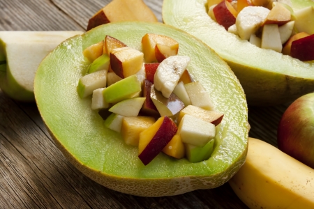 fresh summer fruits salad in half a melon,sweet dessertの写真素材