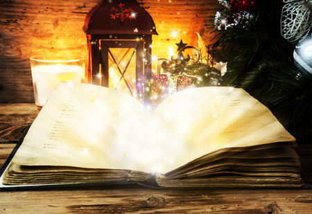 Old Magic Book on Wooden Board and Decorations Backgroundの写真素材