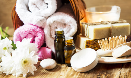 Natural Spa Setting and Treatment with Esential Oils and Cotton Towels, Natural Soap and White Flowersの写真素材