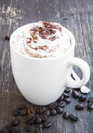 Cappuccino Coffee Cup with Creamy Froth and Cocoa Powderの写真素材