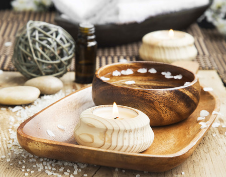 Spa and Wellness Setting with Candle and Water Bowlの写真素材