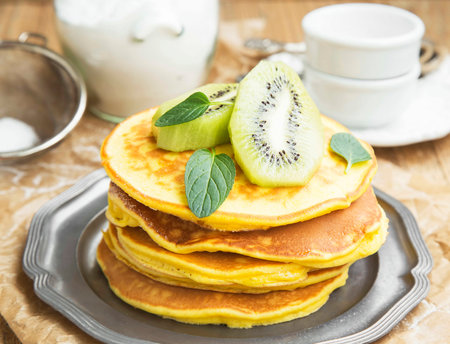 Pancakes with Kiwi Fruits Slices and Mint Leavesの写真素材