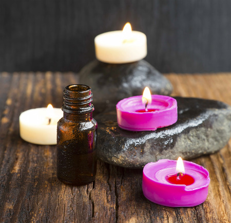Spa with Essence Bottle and Burning Scent Candlesの写真素材