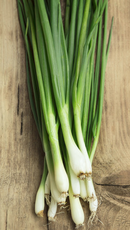 Freshly Picked Green Onion, Bio Vegetables on Wooden Boardの写真素材