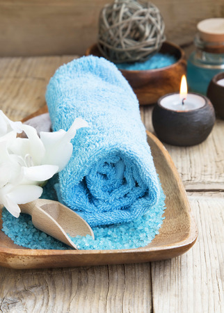 Spa Still Life Setting with Cotton Towel,White Lilies,Candles and Sea Saltの写真素材