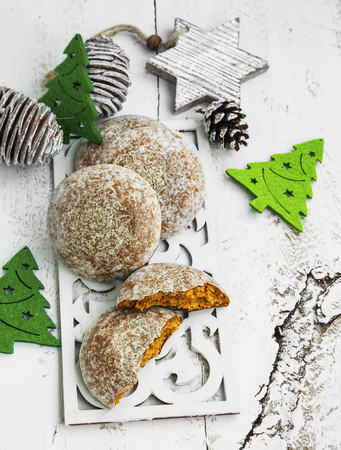 Gingerbread Cookies with Christmas Ornaments on Painted Woodの写真素材