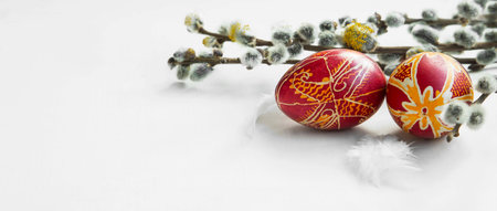 Painted Easter eggs with spring buds branches,Easter spring decoration and feathers