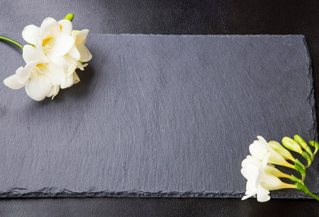 Freesia flowers on black backgrounds.Spa conceptの写真素材