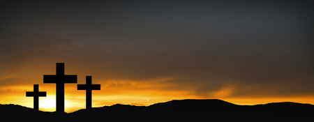 Crosses on the hill over sunset background.Religious concept of crucifixionの写真素材