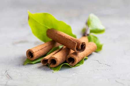 Cinnamon sticks and leaves closeup, spicy aromatic condiment