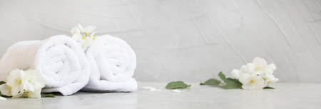 Spa still life with towels and jasmine flowersの写真素材