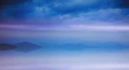 Tranquil foggy lake landscape, beautiful calm peaceful view of a lakeの写真素材