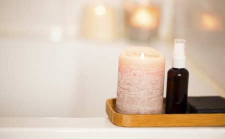 Spa still life setting with candle and body oil, bath home spa and aromatherapy settingの写真素材