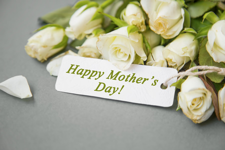 Happy Mother's Day greeting with white tulips bouquet, spring Mother's Day cardの写真素材