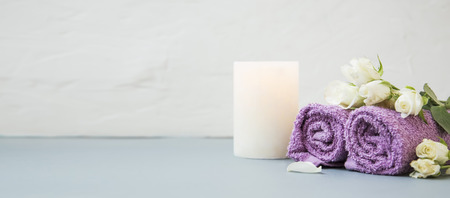 Spa still life with towels,rose flowers, bath salt and candle setting, wellness and spa still life compositionの写真素材