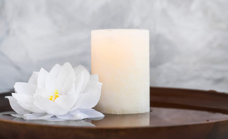 Spa still life with candle and water lily, spa still life composition natural wellness still life with candle and lotus in water backgroundの写真素材